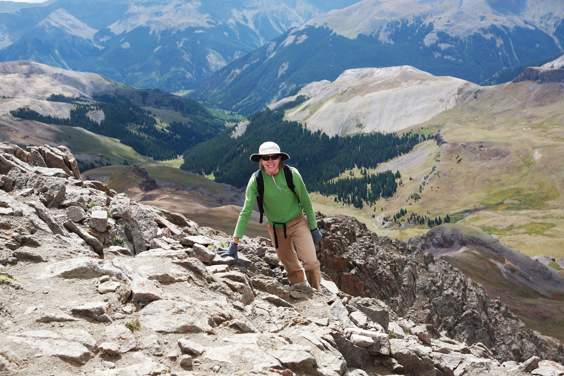 Fit mature woman climbing Mt Wetterhorn, San Juan Mountains, Colorado.